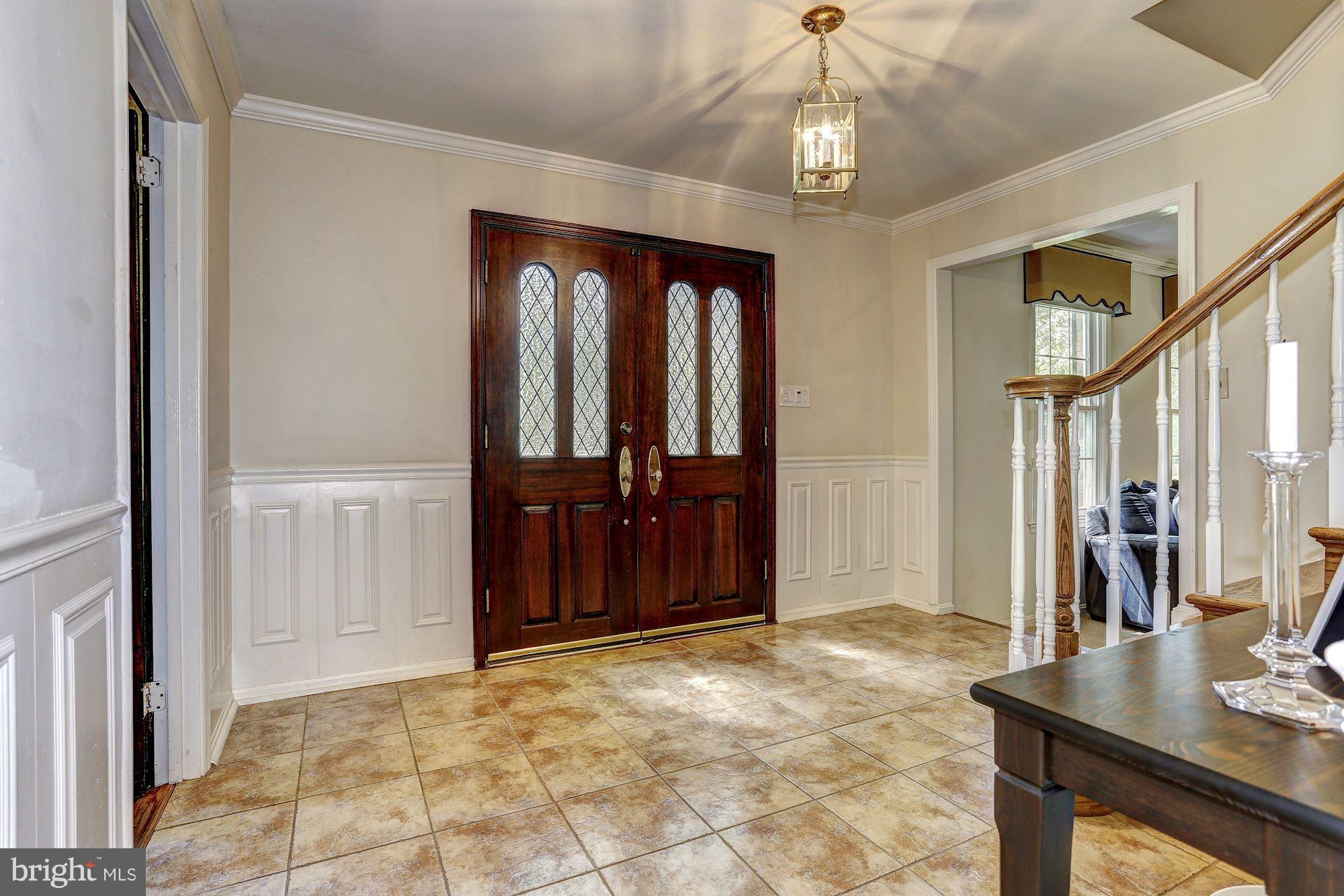 Welcoming foyer with updated ceramic floor
