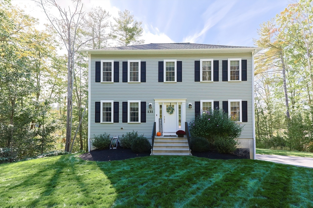 131 Pommogussett Road Rutland, MA 01543 - Photo 1 of 38 a view of a house with backyard and garden