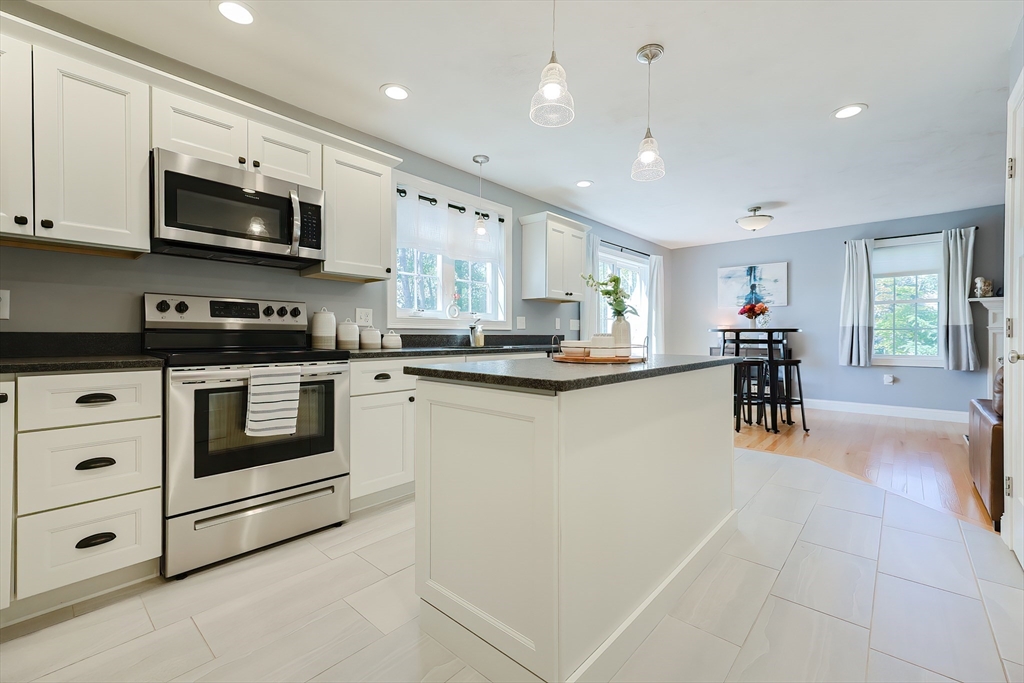 131 Pommogussett Road Rutland, MA 01543 - Photo 12 of 38 a kitchen with stainless steel appliances granite countertop a refrigerator and a stove top oven