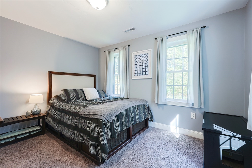131 Pommogussett Road Rutland, MA 01543 - Photo 19 of 38 a spacious bedroom with a bed and window