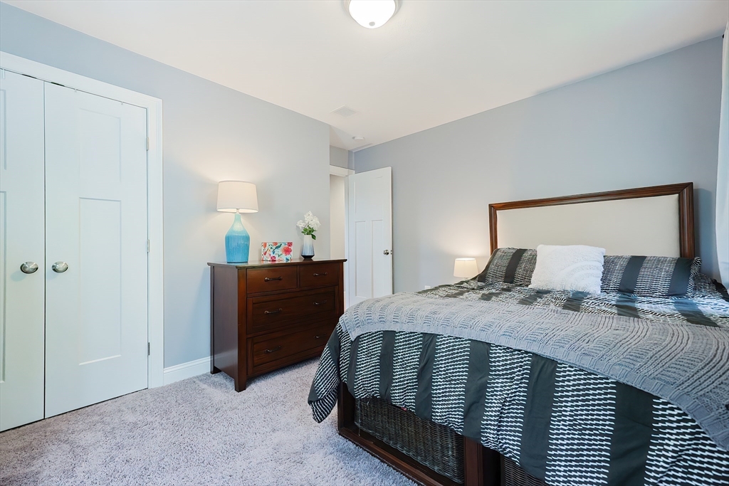 131 Pommogussett Road Rutland, MA 01543 - Photo 20 of 38 a bedroom with a bed and a mirror