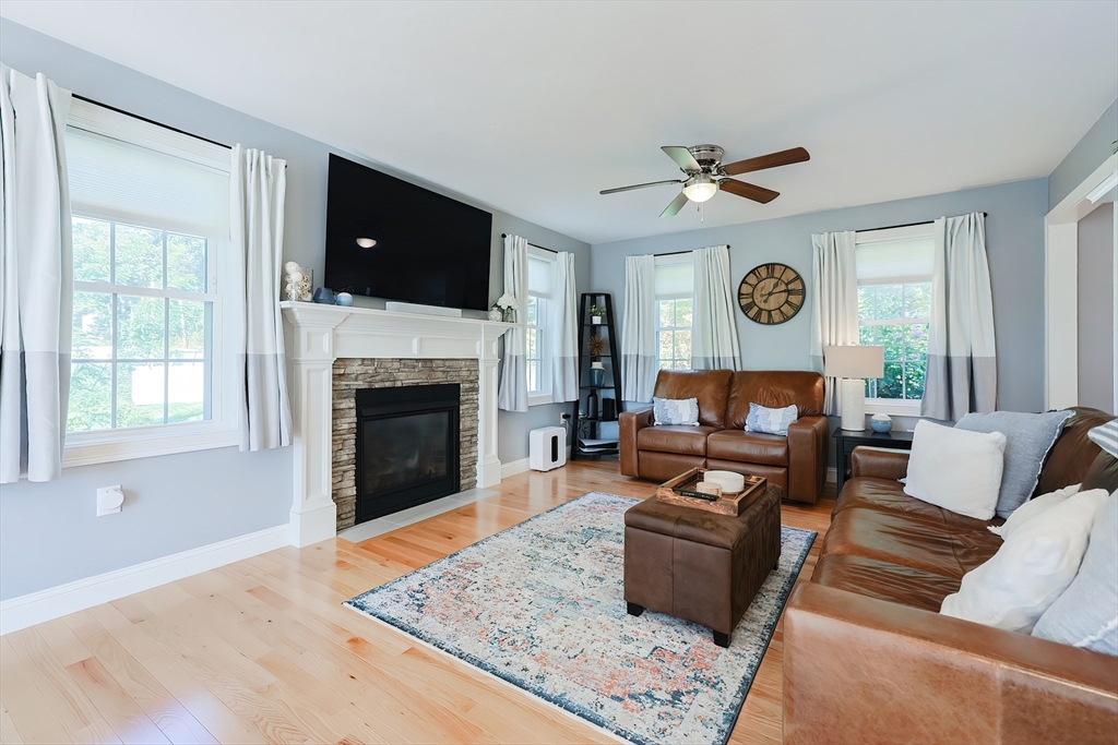131 Pommogussett Road Rutland, MA 01543 - Photo 2 of 38 a living room with furniture and a fireplace