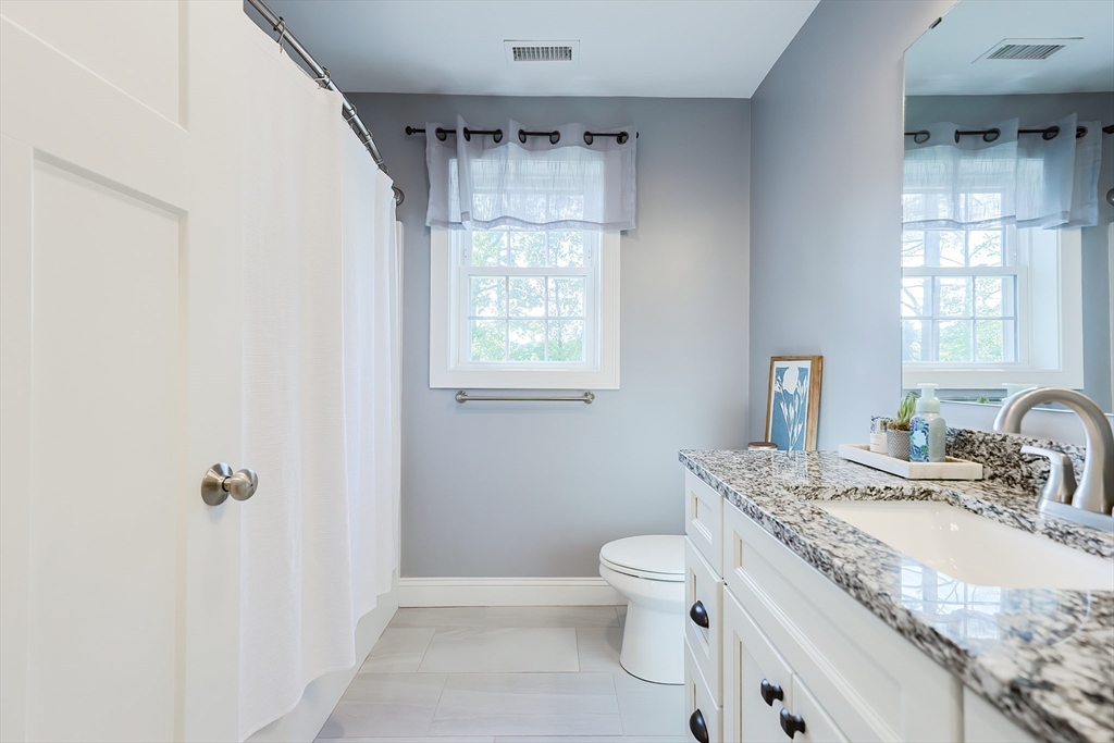 131 Pommogussett Road Rutland, MA 01543 - Photo 23 of 38 a bathroom with a granite countertop sink a toilet and shower
