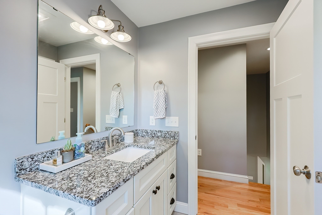 131 Pommogussett Road Rutland, MA 01543 - Photo 24 of 38 a bathroom with a granite countertop double vanity sink and a mirror