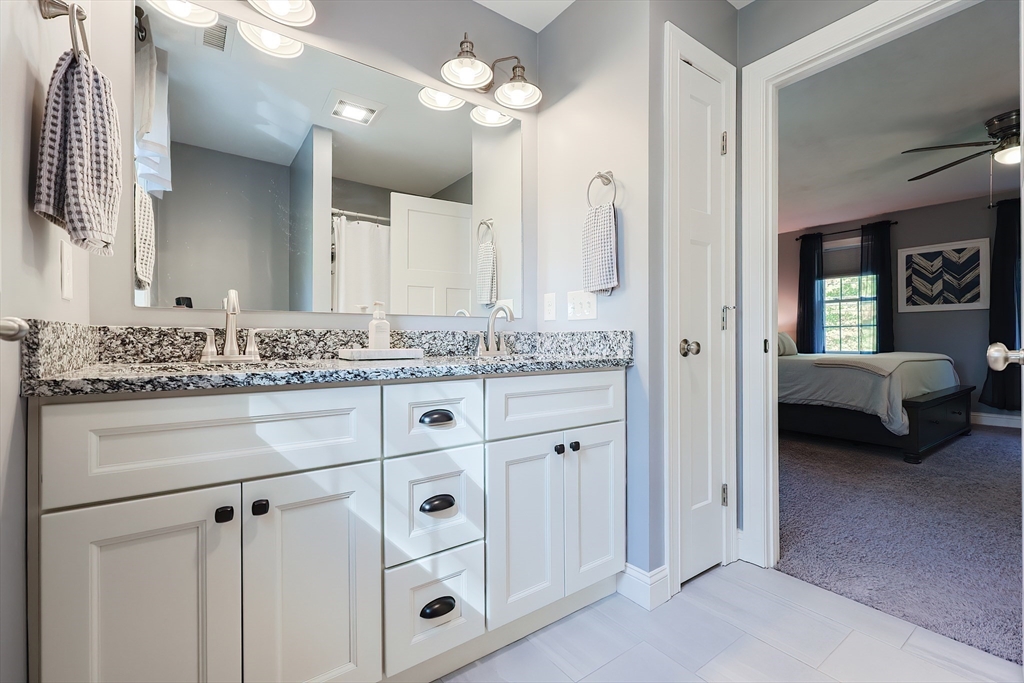 131 Pommogussett Road Rutland, MA 01543 - Photo 29 of 38 a en suite bathroom with a granite countertop sink and a mirror