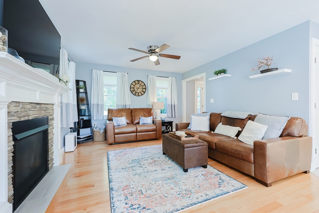 131 Pommogussett Road Rutland, MA 01543 - Photo 3 of 38 a living room with furniture and a fireplace