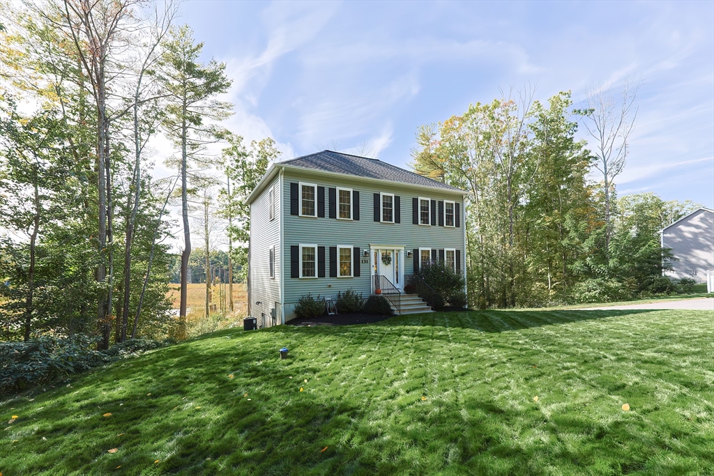 131 Pommogussett Road Rutland, MA 01543 - Photo 32 of 38 a view of a house with a yard and a garden