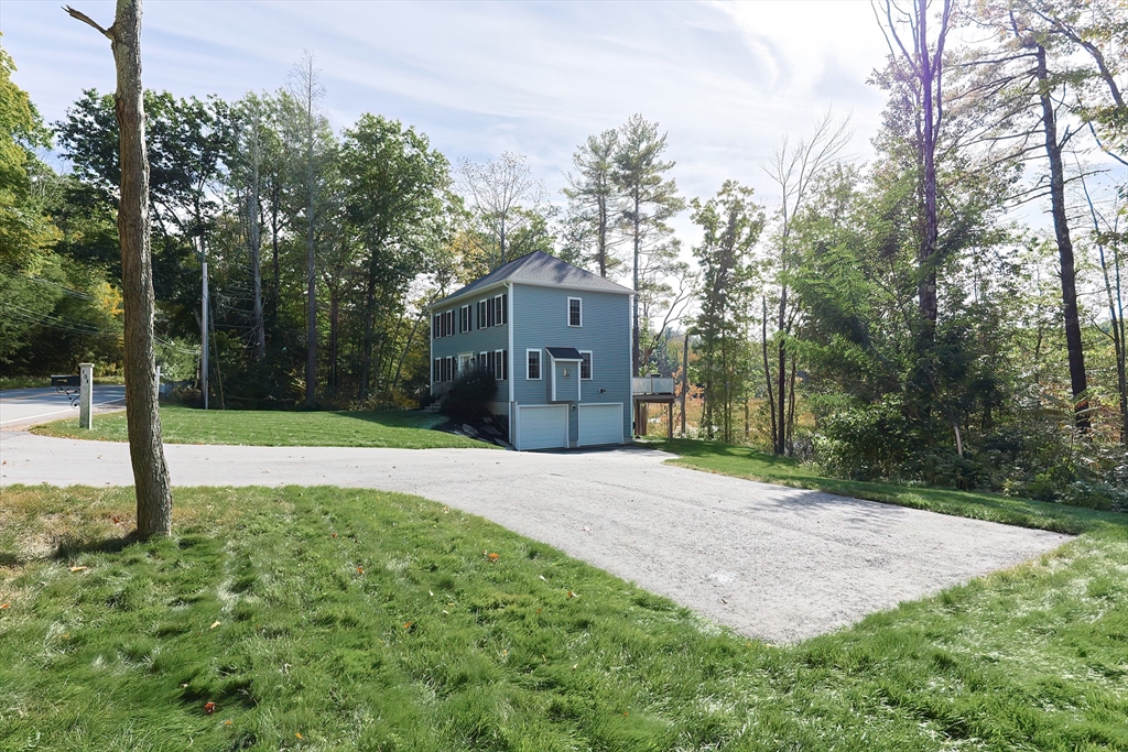 131 Pommogussett Road Rutland, MA 01543 - Photo 33 of 38 a house that has a tree in front of it