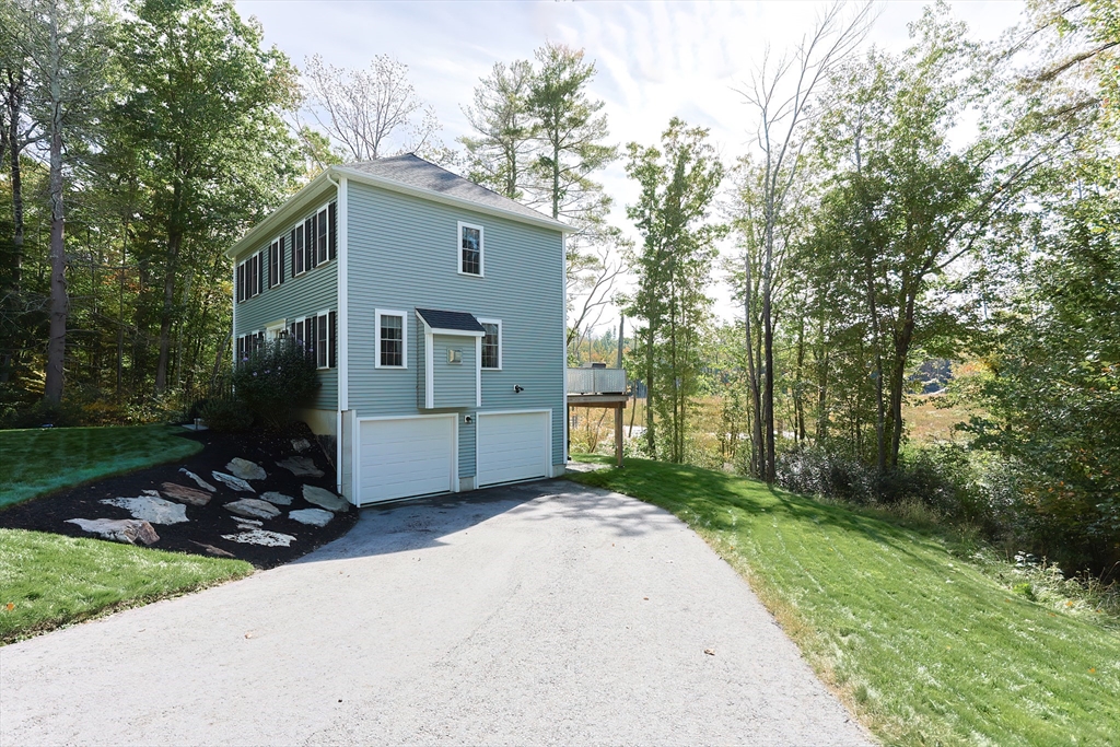 131 Pommogussett Road Rutland, MA 01543 - Photo 34 of 38 a view of a house with backyard and garden