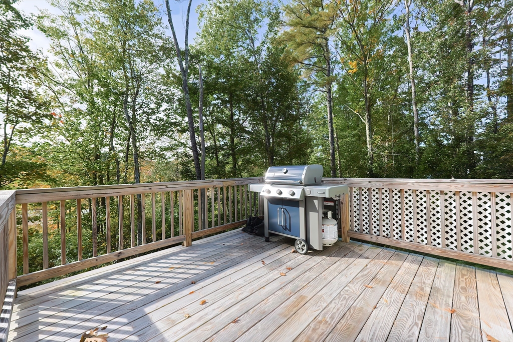 131 Pommogussett Road Rutland, MA 01543 - Photo 36 of 38 a view of a deck with wooden floor and fence