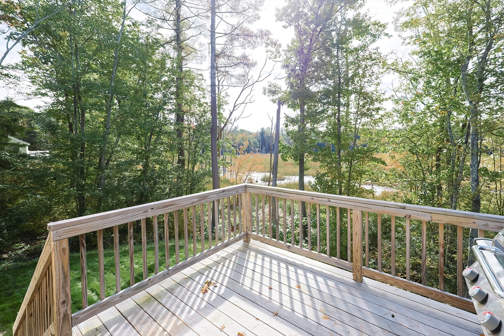 131 Pommogussett Road Rutland, MA 01543 - Photo 38 of 38 a balcony with wooden floor and trees