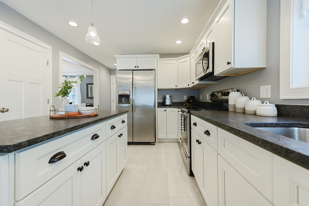 131 Pommogussett Road Rutland, MA 01543 - Photo 10 of 38 a large kitchen with stainless steel appliances lots of counter space and a sink