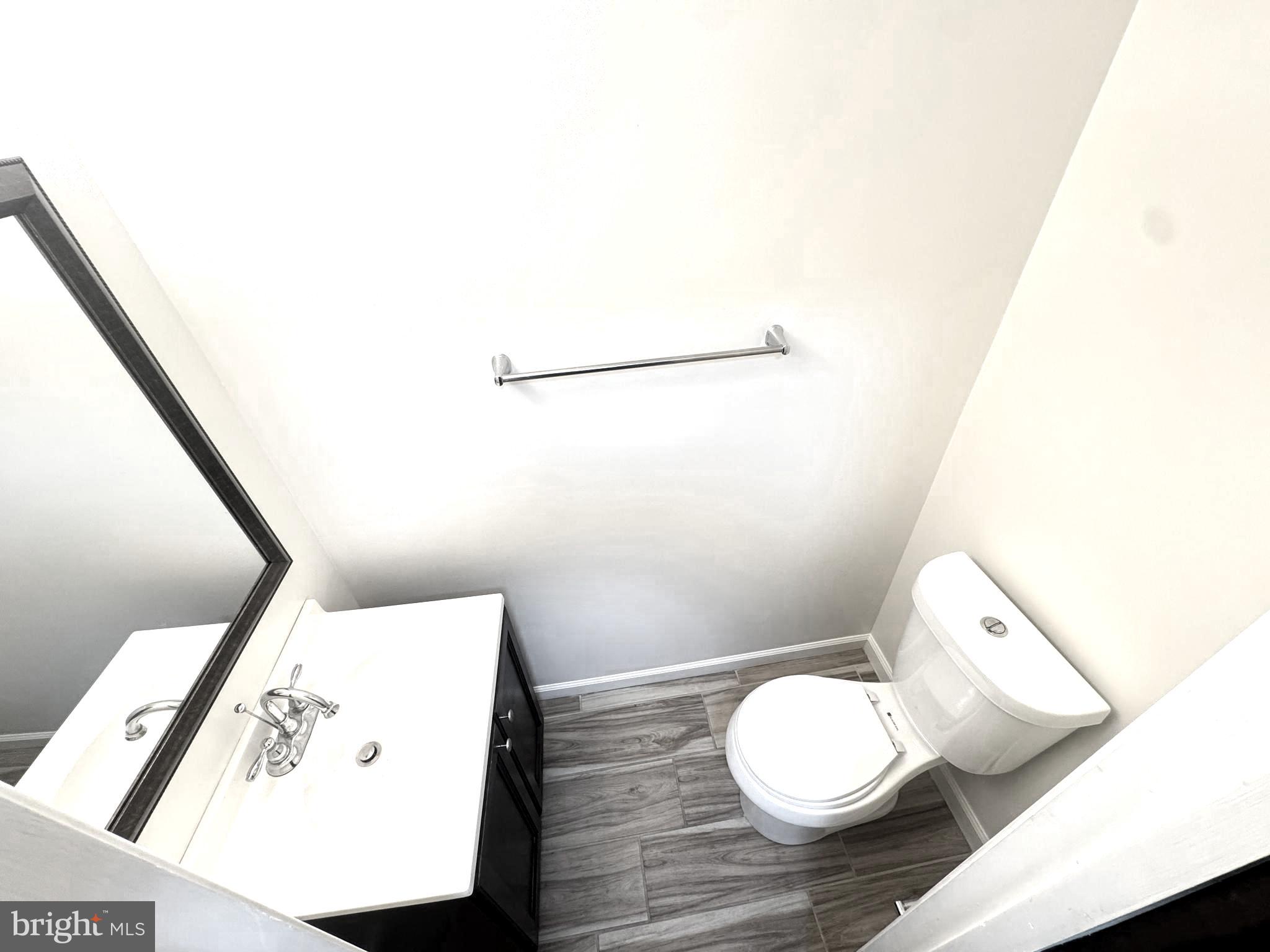 9250 Three Oaks Drive Silver Spring, MD 20901 - Photo 16 of 45 a bathroom with a toilet and a sink