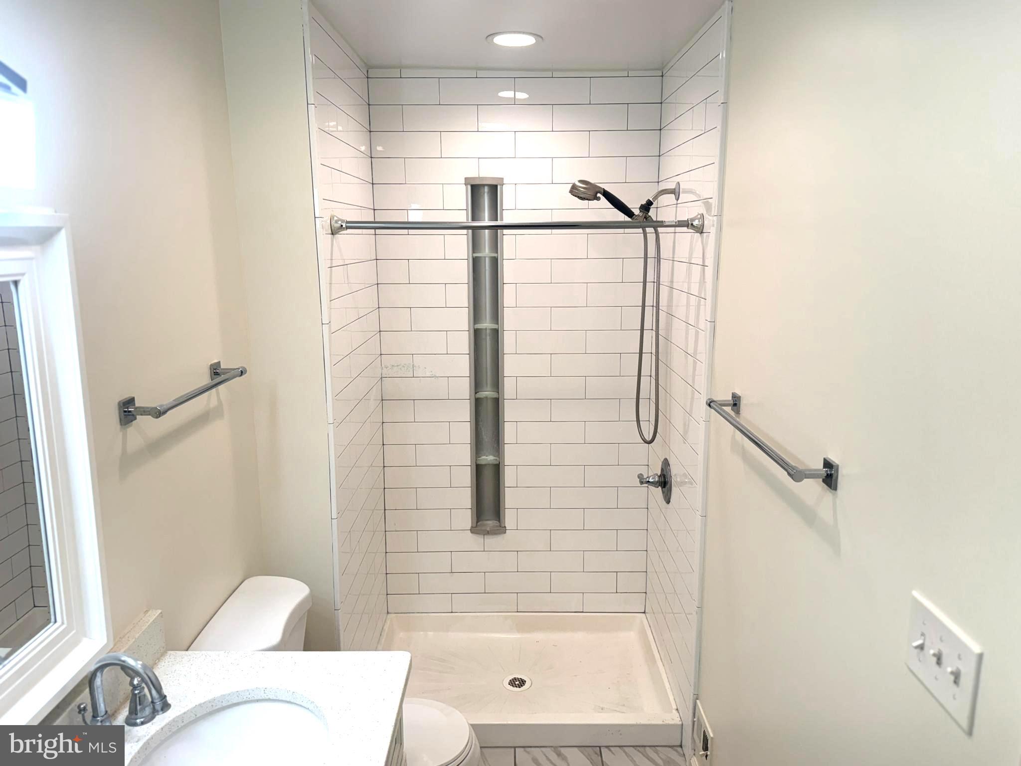 9250 Three Oaks Drive Silver Spring, MD 20901 - Photo 24 of 45 a bathroom with a shower and a toilet