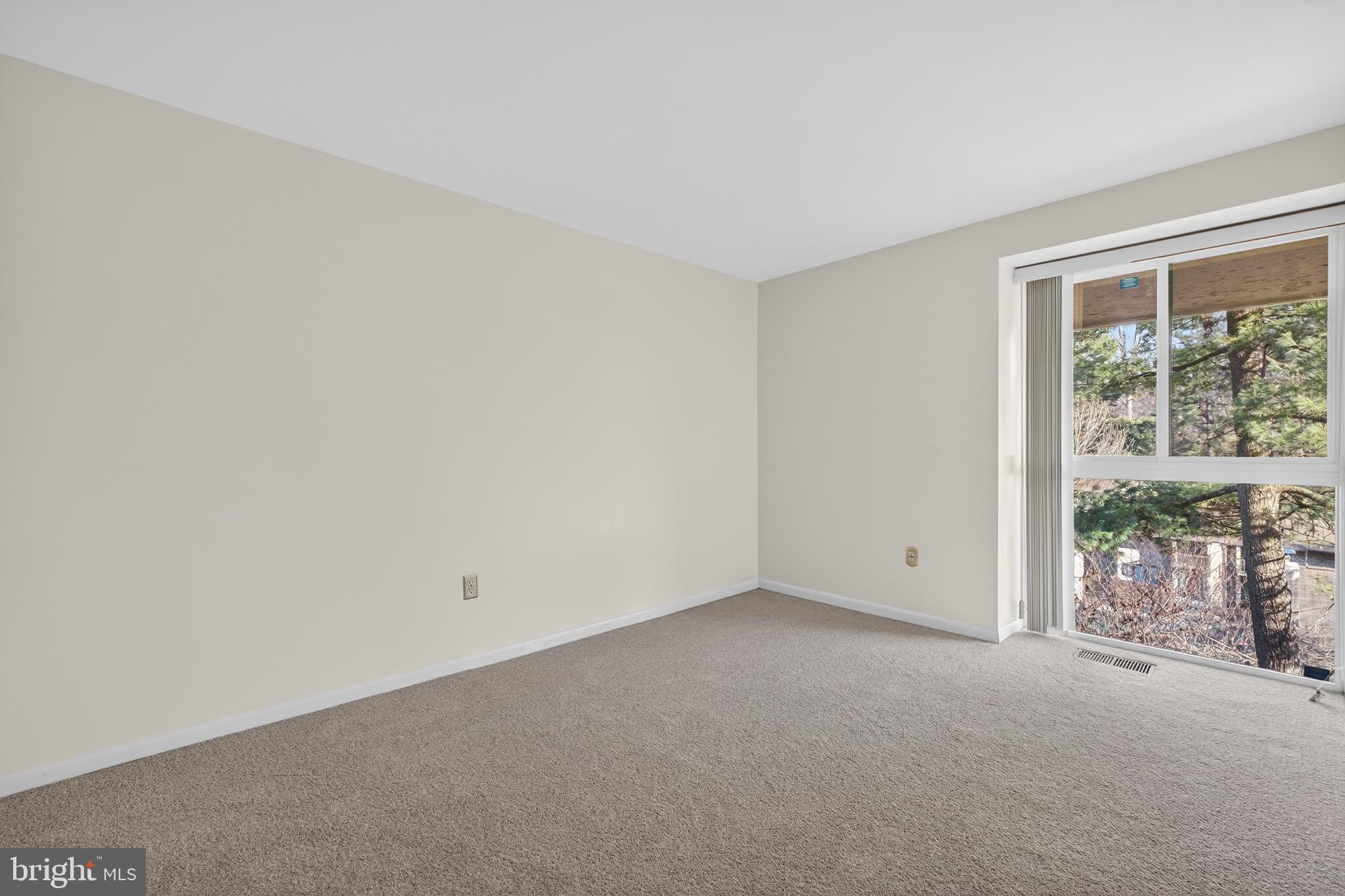 9250 Three Oaks Drive Silver Spring, MD 20901 - Photo 27 of 45 a view of an empty room with a window