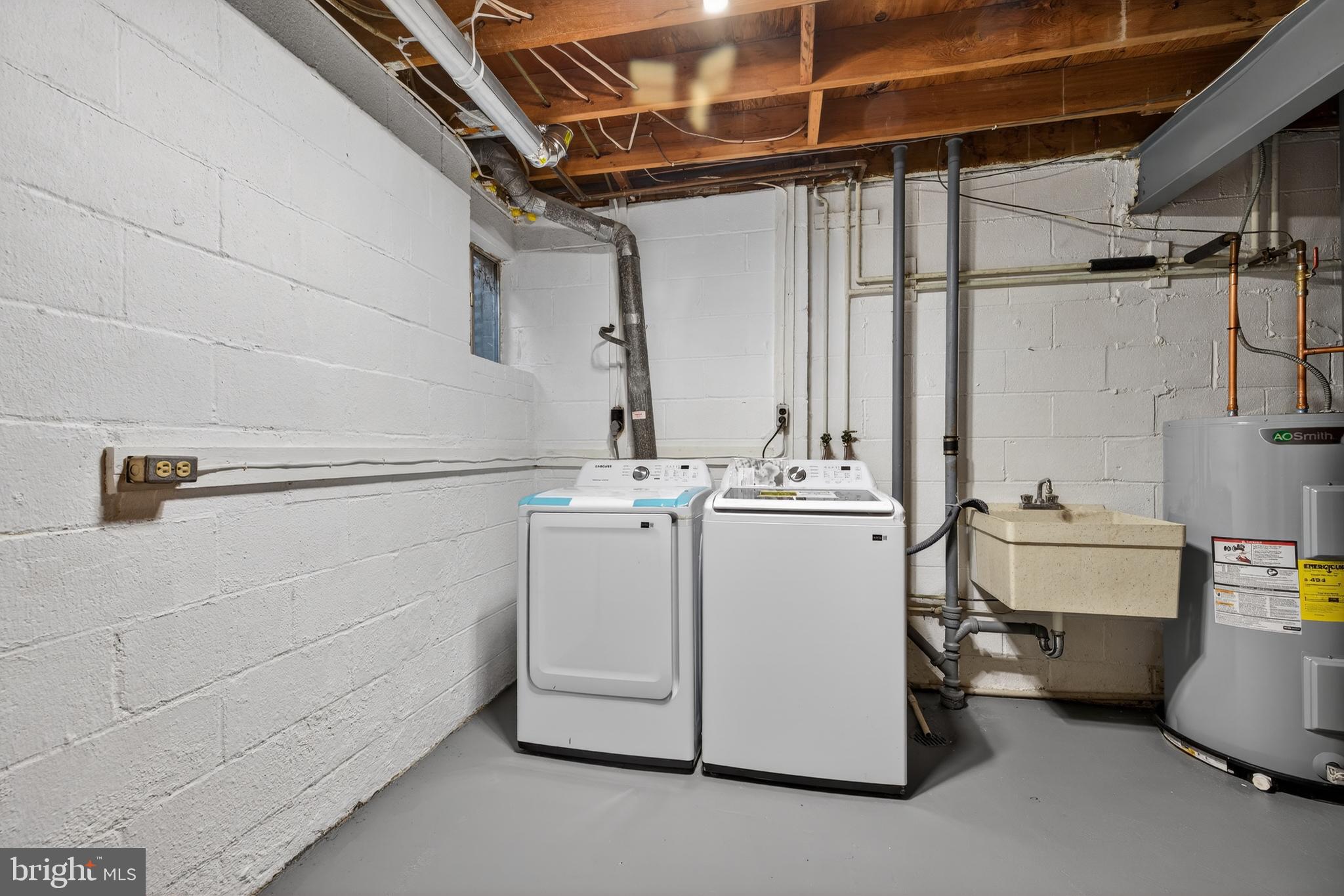 9250 Three Oaks Drive Silver Spring, MD 20901 - Photo 38 of 45 a utility room with dryer and washer