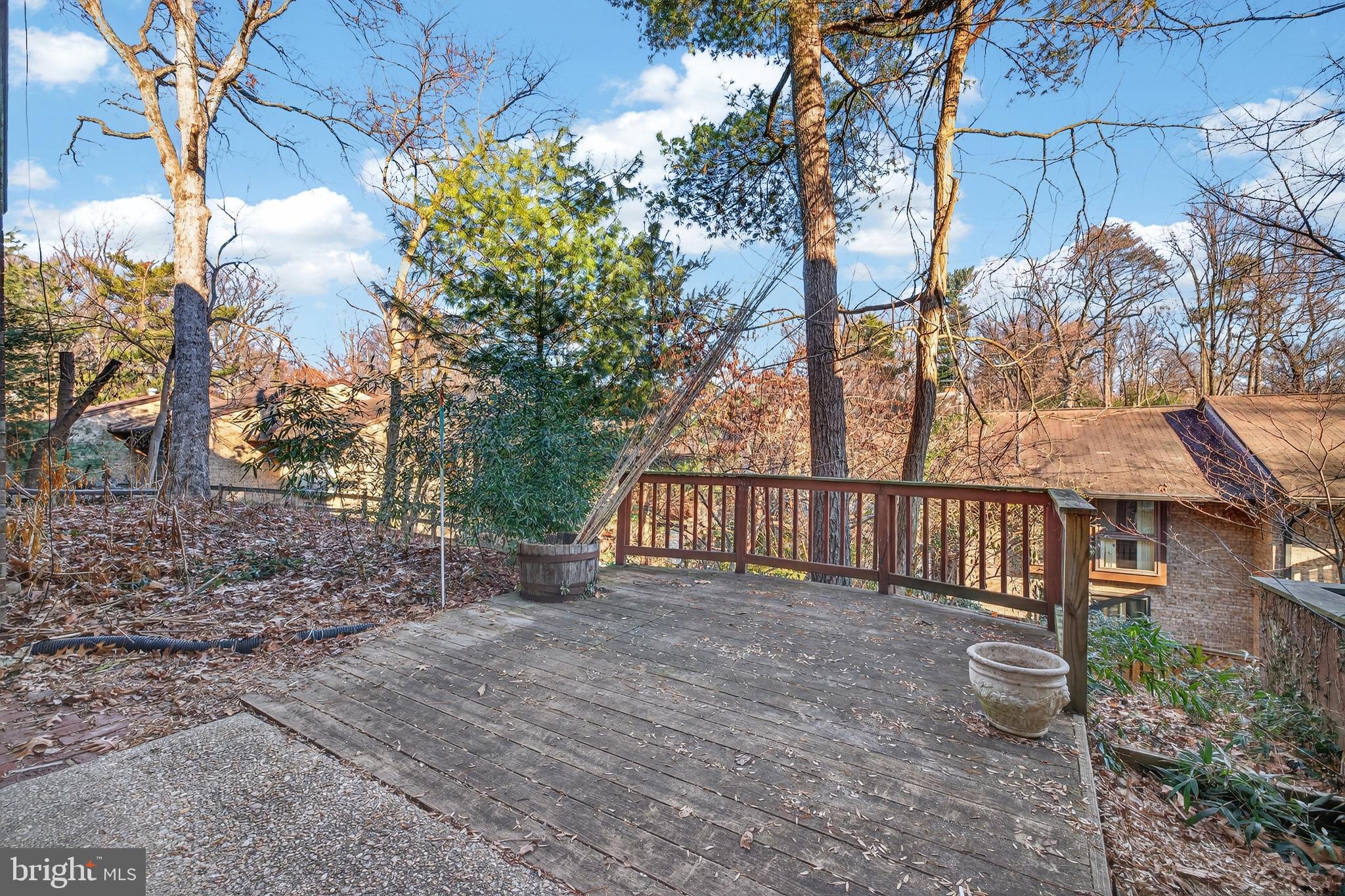 9250 Three Oaks Drive Silver Spring, MD 20901 - Photo 40 of 45 a view of a pathway with a wrought fence