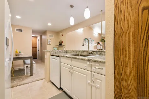 a bathroom with a sink a mirror and a shower