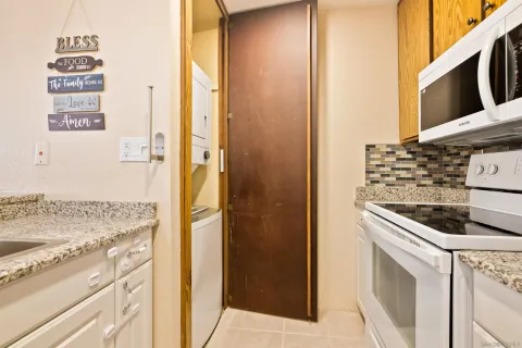 a kitchen with a stove and a refrigerator
