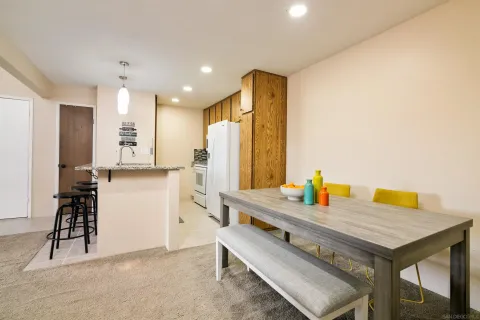 a kitchen with sink cabinets and refrigerator