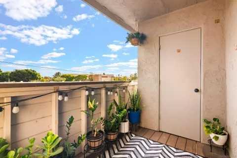 a view of balcony with wooden floor