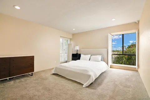 a bedroom with a bed and a dresser