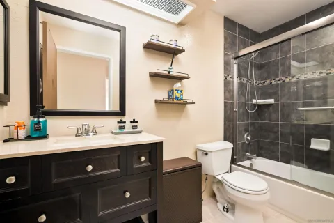 a picture of a bench in front of a wall