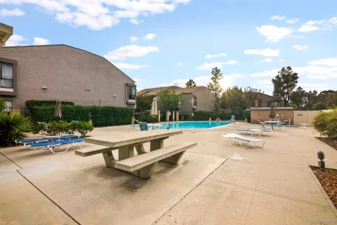 a front view of a house with a yard and fountain