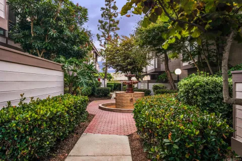 a view of a garden with benches