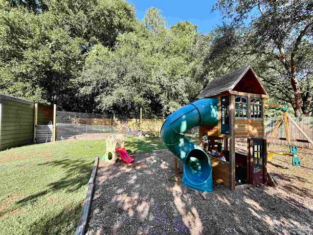 a backyard of a house with lots of green space