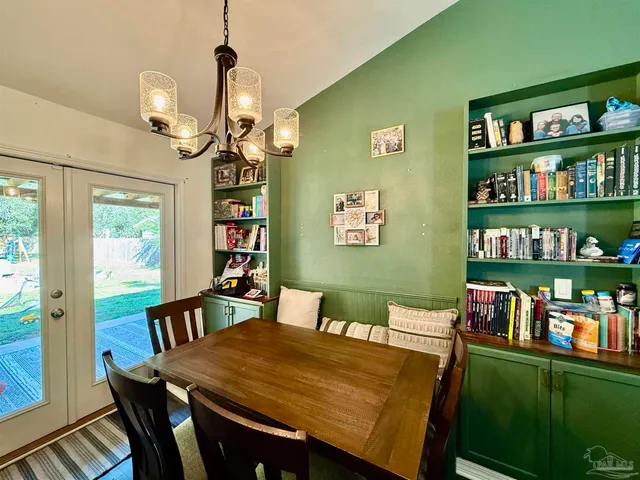 a view of a dining room with furniture window and outdoor kitchen