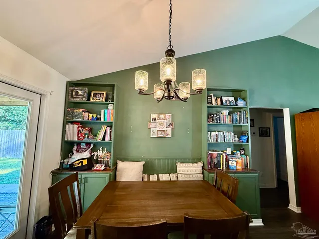 a view of a dining room with furniture