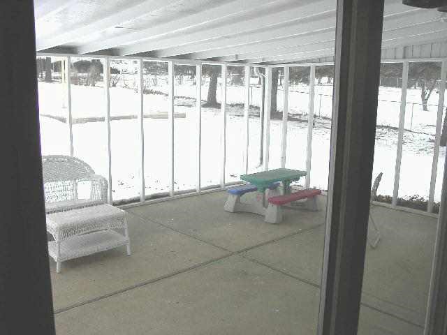890 West Fairgrounds Road Freeport, IL 61032 - Photo 5 of 7 a living room with furniture and a large window