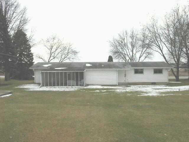 890 West Fairgrounds Road Freeport, IL 61032 - Photo 7 of 7 a view of a house with a yard and garage