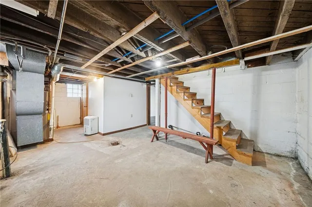 a view of an empty room with stairs