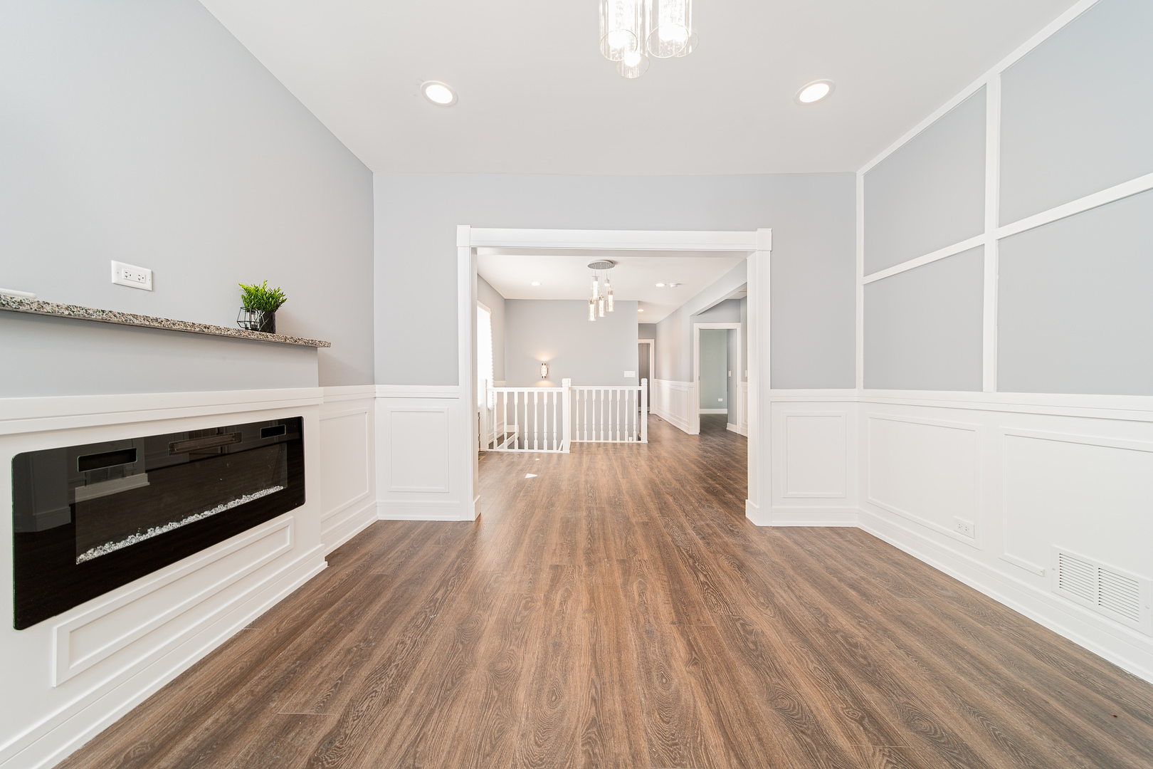11354 South Harvard Avenue Chicago, IL 60628 - Photo 8 of 25 a view of a room wooden floor and fire place