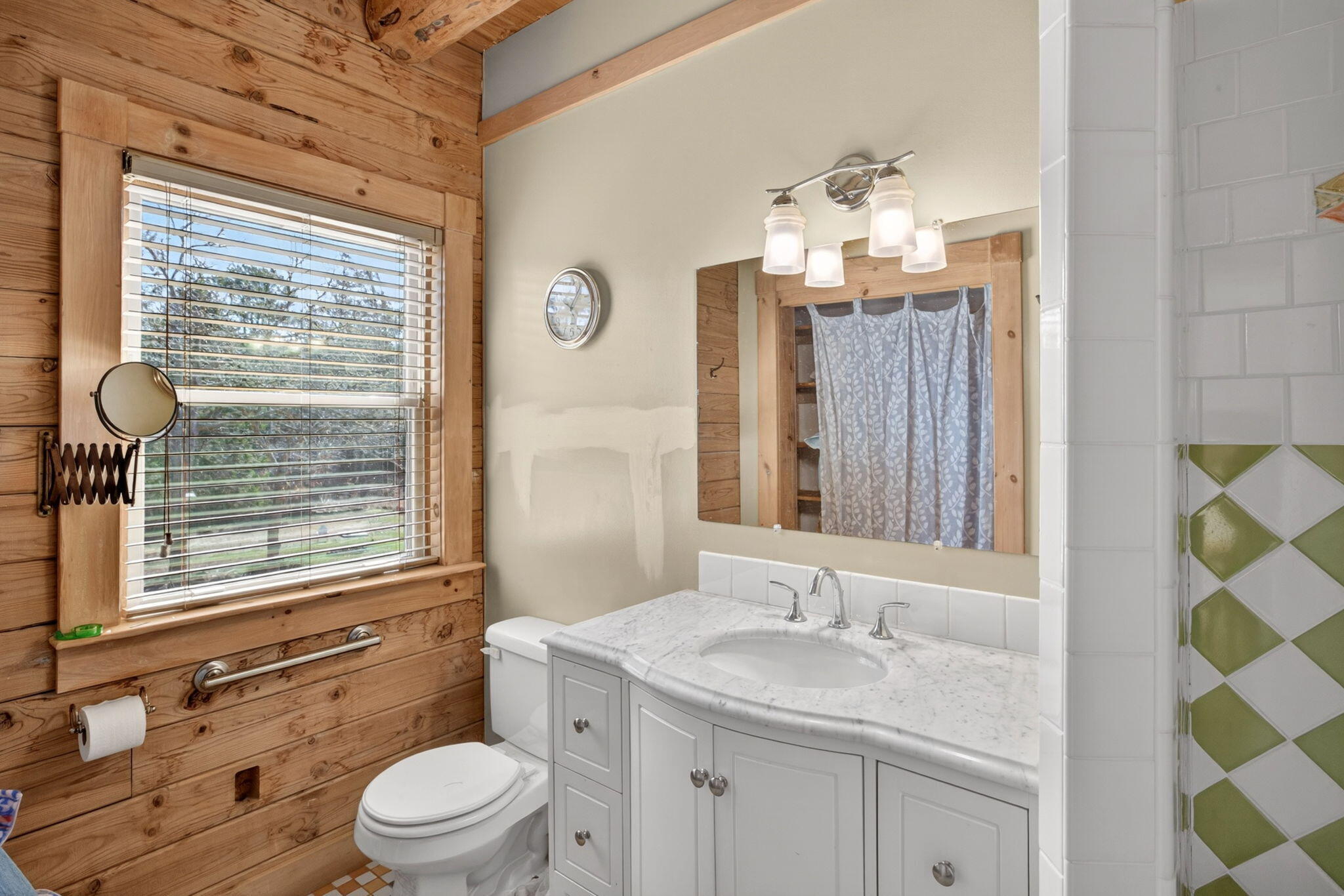 73 County Road Bourne, MA 02532 - Photo 26 of 91 a bathroom with a toilet a sink and a large mirror