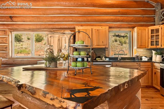 35 Toms Ranch Rd Lake Lake George, CO 80827 - Photo 13 of 50 Custom live-edge island top featuring hand carvings