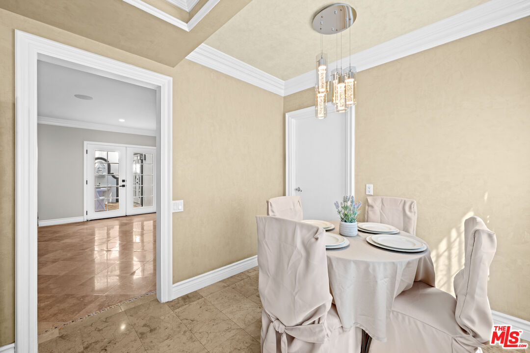 2563 Hutton Drive Beverly Hills, CA 90210 - Photo 13 of 69 a view of a dining room with furniture window and wooden floor