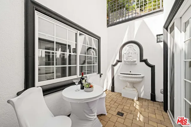 a dining room with furniture and a fireplace