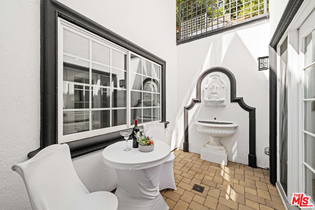 2563 Hutton Drive Beverly Hills, CA 90210 - Photo 16 of 69 a living room with furniture a window and a potted plant