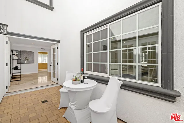 a view of a dining room with furniture and a fireplace