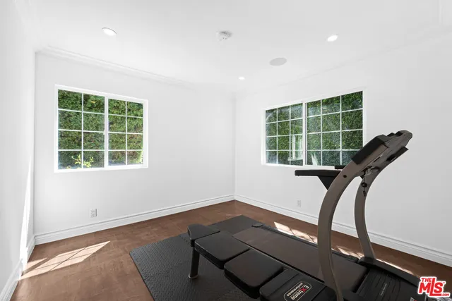 a bed room with a bed and a window