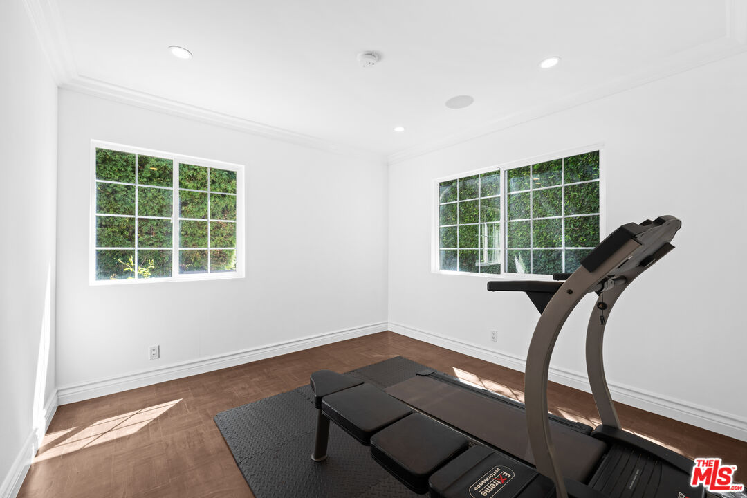 2563 Hutton Drive Beverly Hills, CA 90210 - Photo 24 of 69 a view of a workspace with furniture and a window