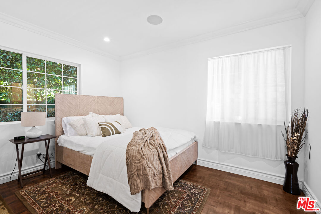 2563 Hutton Drive Beverly Hills, CA 90210 - Photo 27 of 69 a bed room with a bed and a window