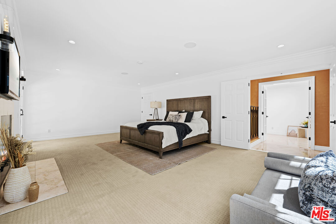 2563 Hutton Drive Beverly Hills, CA 90210 - Photo 37 of 69 a bedroom with a bed and a flat screen tv