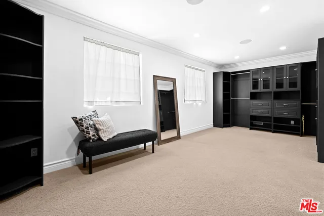 a view of a patio with couches table and chairs and potted plants