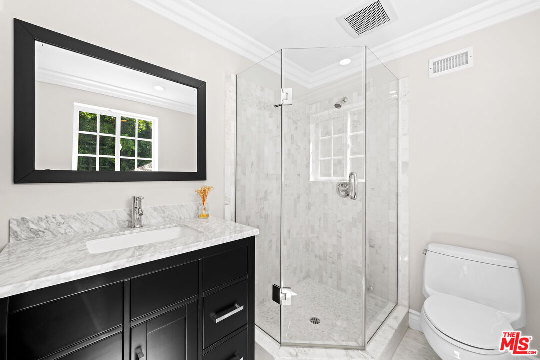 2563 Hutton Drive Beverly Hills, CA 90210 - Photo 47 of 69 a bathroom with a sink a toilet and shower