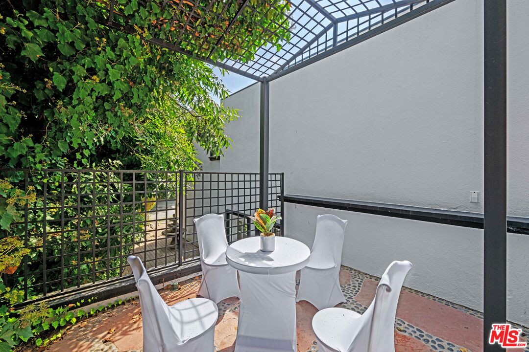 2563 Hutton Drive Beverly Hills, CA 90210 - Photo 49 of 69 a backyard of a house with table and chairs