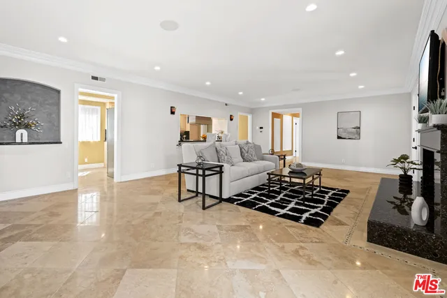 a living room with furniture and a rug